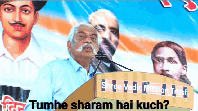 a man stands at a podium with the words tumhe sharam hai kuch on it