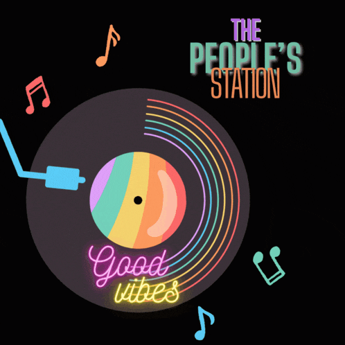 a neon sign that says " good vibes " on a record