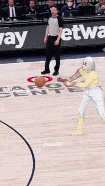 a basketball game is being played in front of a sign that says nglert