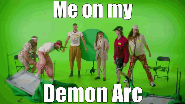 a group of people are standing in front of a green screen with the caption me on my demon arc