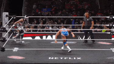 a wrestling ring with a sign that says netflix in the corner