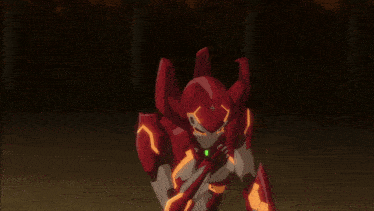 a red robot with green eyes and a green star on it 's chest