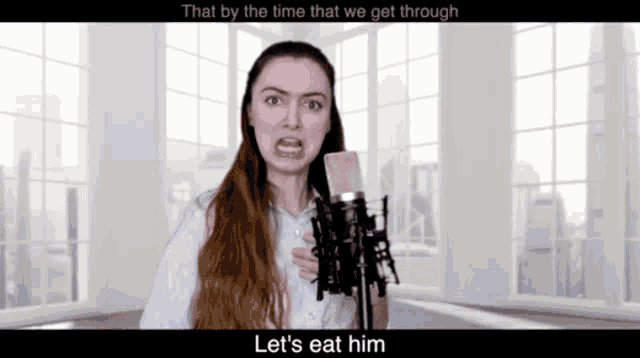 a woman is singing into a microphone with the words let 's eat him below her