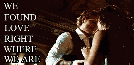 a man is putting a ring on a woman 's finger with the words we found love behind them