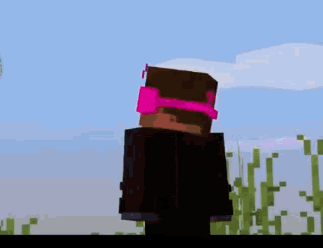 a minecraft character wearing a suit and tie is standing in a field of grass .