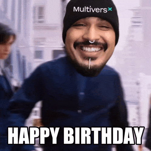 a man wearing a hat that says multivers on it is smiling and says happy birthday