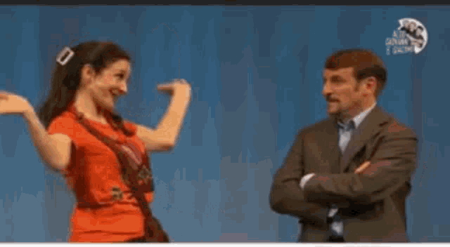 a man and a woman are dancing with the words tanto la mattina e andata a puttane in the corner