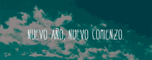 a blue sky with white clouds and the words nuevo ano nuevo comienzo in white letters