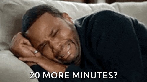 a man is crying while laying on a couch and says `` 20 more minutes ? ''