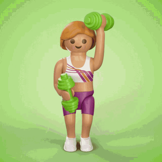 a playmobil figure is lifting a green dumbbell over her head