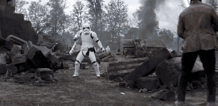 a storm trooper is standing in front of a man in a brown jacket .