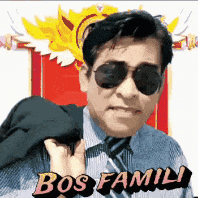 a man wearing sunglasses and a tie is holding his jacket over his shoulder and says bos family