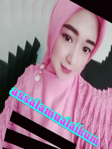 a woman wearing a pink hijab with the words assalamualaikum written on it