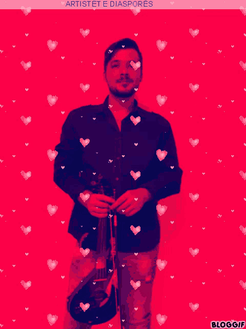 a man holding a violin in front of a red background with hearts and the words artistet e diasporas