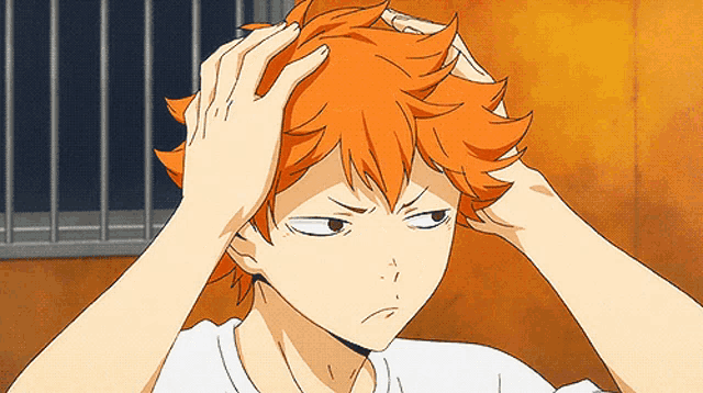 a cartoon character with orange hair is holding his head