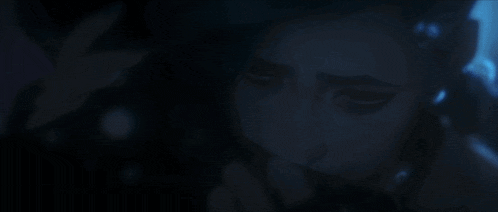a close up of a person 's face with a dark background