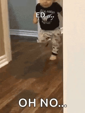 a baby is running through a doorway with the words `` oh no '' written on it .