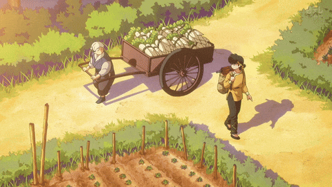 a man pushes a cart full of vegetables while another man walks behind him
