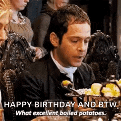 a man is sitting at a table with a bowl of boiled potatoes on it .