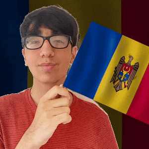 a man wearing glasses holds a flag in front of a flag