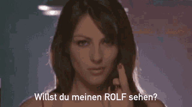 a close up of a woman 's face with the words willst du meinen rolf sehen below her