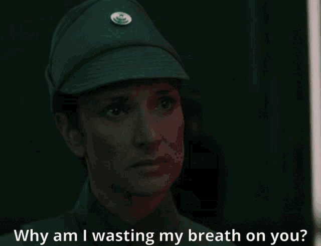 a close up of a woman 's face with the words " why am i wasting my breath on you " below her