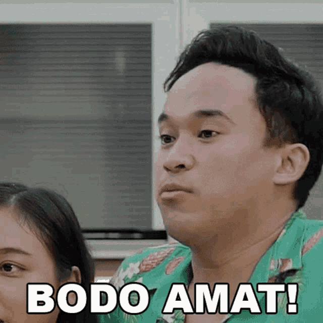 a man in a green shirt says bodo amat while looking at a woman