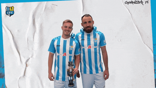 two soccer players wearing blue and white striped shirts with cfc written on the bottom