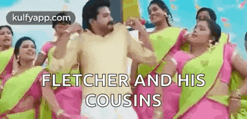 a man is dancing with a group of women in pink and green saree .