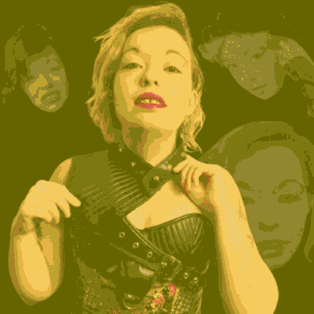 a woman in a black leather top is surrounded by other women