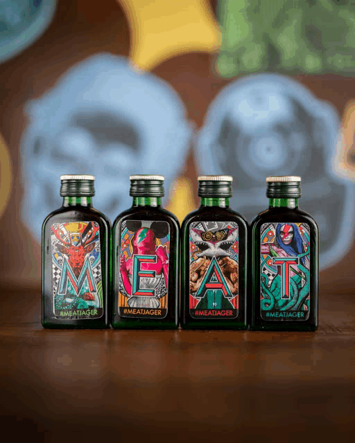 four bottles of meat jager sit on a table