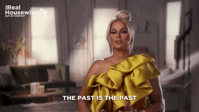 a woman in a yellow dress with the words " the past is the past "