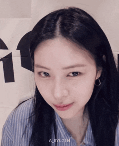 a close up of a woman 's face with the name a_ryujin visible