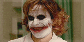 a close up of a person wearing a joker mask