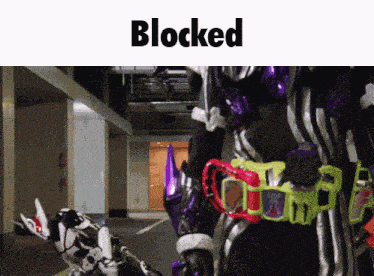 a picture of a robot with the word blocked on top