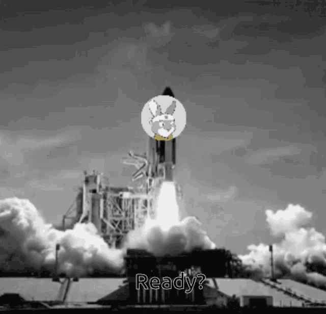 a black and white photo of a rocket being launched with the words " ready " below it