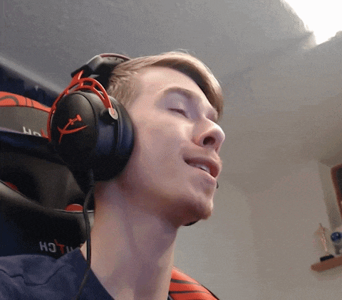 a man wearing headphones with the word hot on the back of his shirt