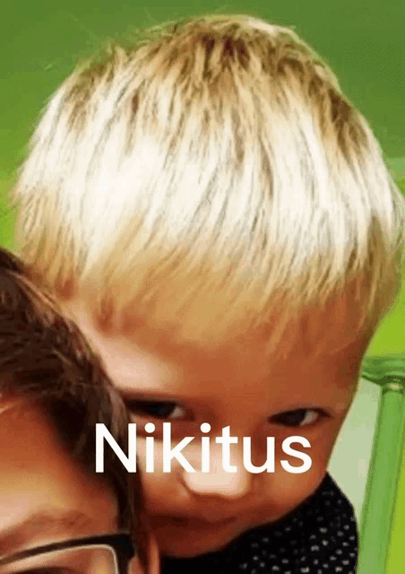 a child with the name nikitus written on his face