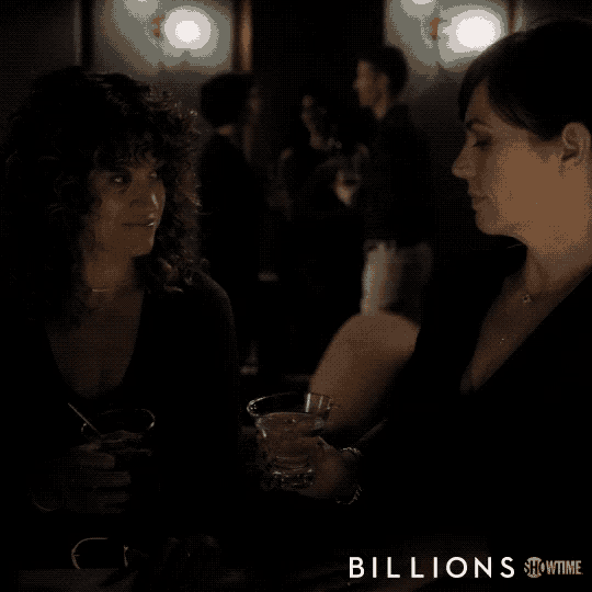 two women sitting next to each other with the words billions showtime on the bottom