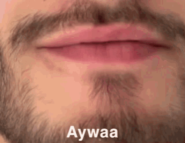 a close up of a man 's mouth with the words aywaa written on it