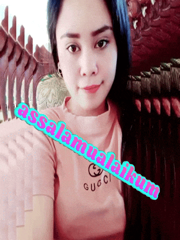 a woman wearing a pink gucci t-shirt says " assalamualaikum "