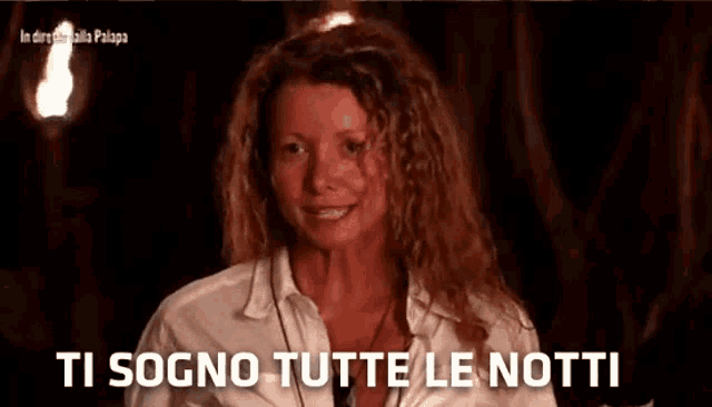 a woman says " ti sogno tutte le notti " in a video