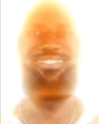 a close up of a man 's face with a smile on his face .