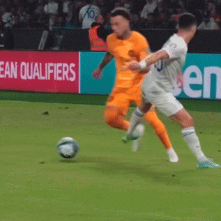 soccer players on a field with a sign that says ' european qualifiers ' on it