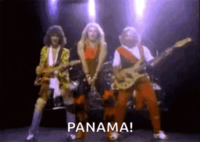 a group of people are standing on a stage playing guitars and singing .