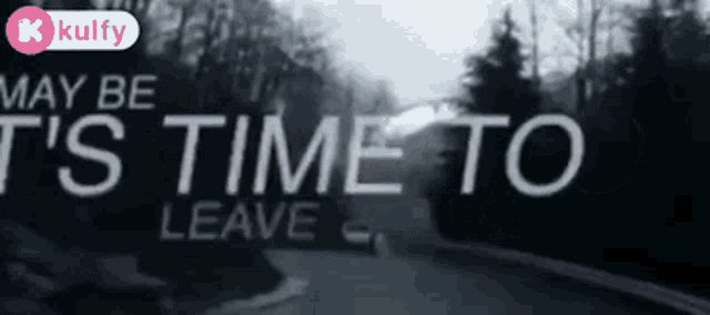 a blurred image of a road with the words may be t 's time to leave