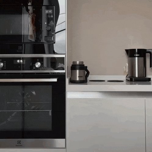 an electrolux oven sits next to a bosch kettle on a counter