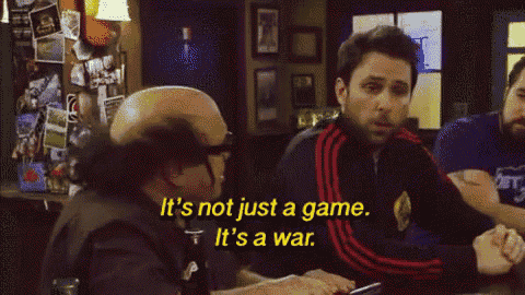 a man says it 's not just a game it 's a war while sitting at a table