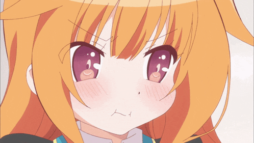 a close up of a girl 's face with orange hair