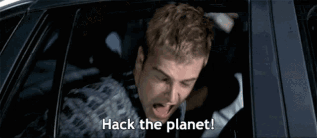a man is sitting in a car with his mouth open and the words hack the planet .